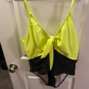 green and black swimsuit - could be neon yellow